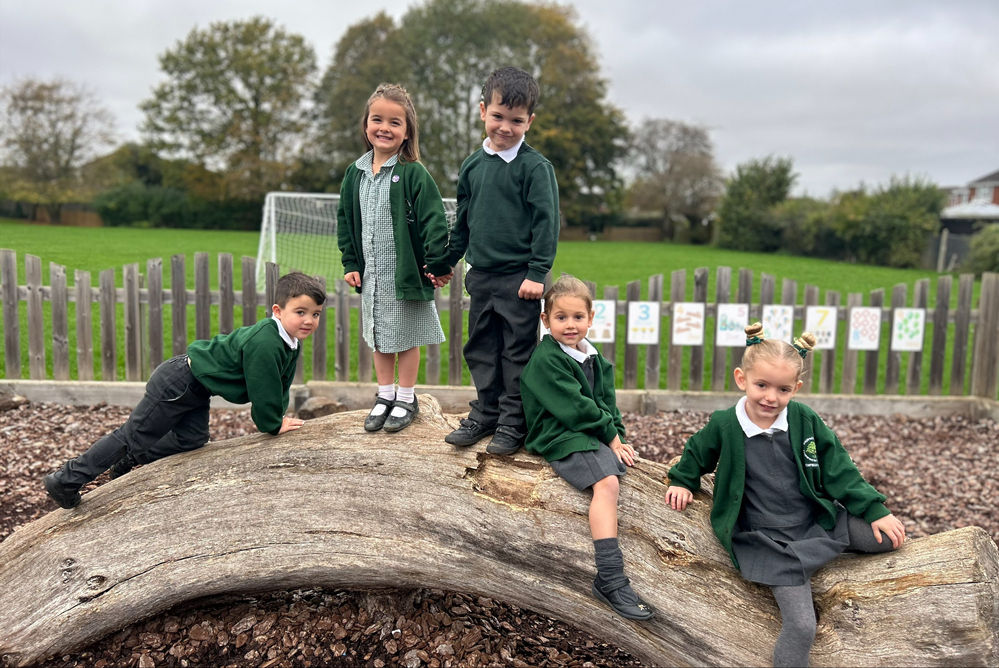 EYFS pupils playing outside
