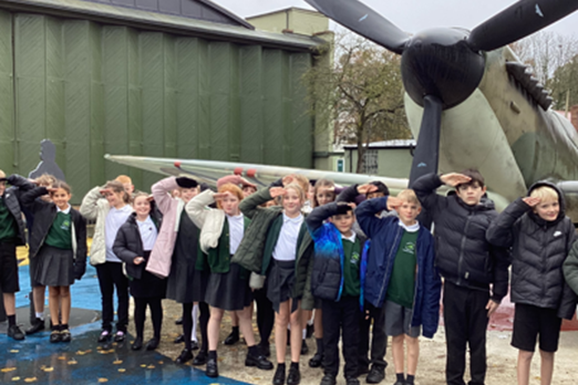 cropped-History-Trip.png Pupils standing in front of a WW2 plane