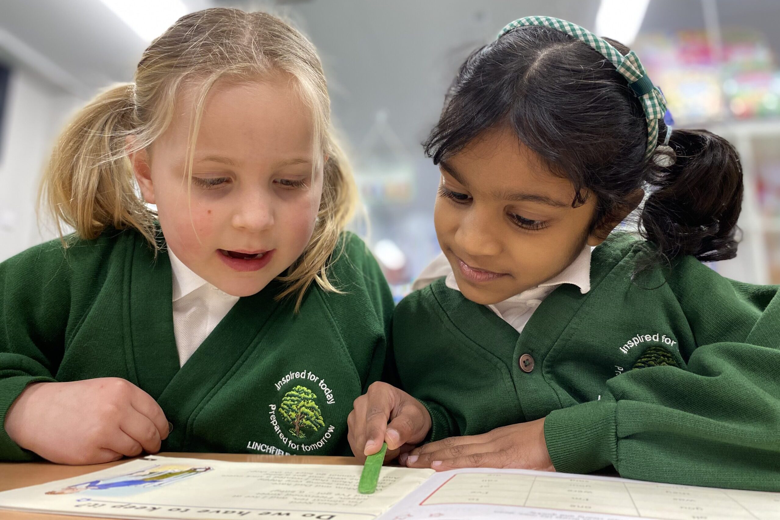 Linchfield Uniform pupils in uniform writing together