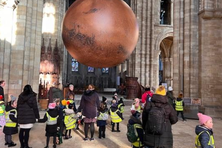 cropped-Linch-Geography1.png pupils on a school trip inside a cathedral