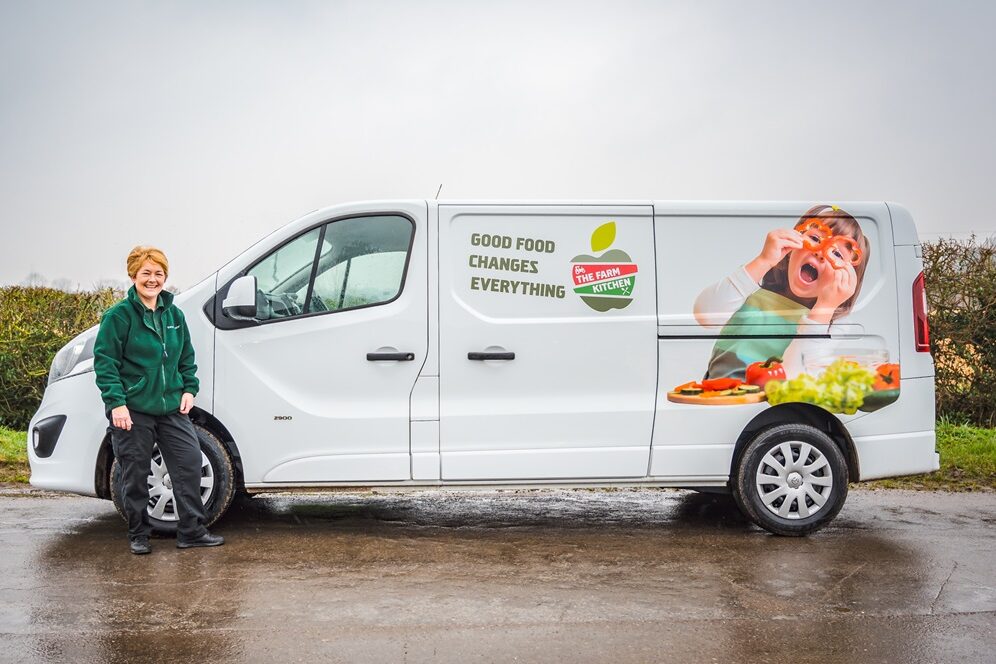 The Farm Kitchen van with a Farm Kitchen member of staff