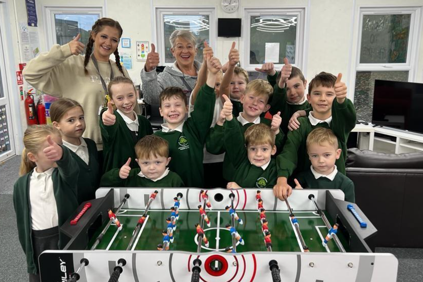 pupils and staff having table football fun!