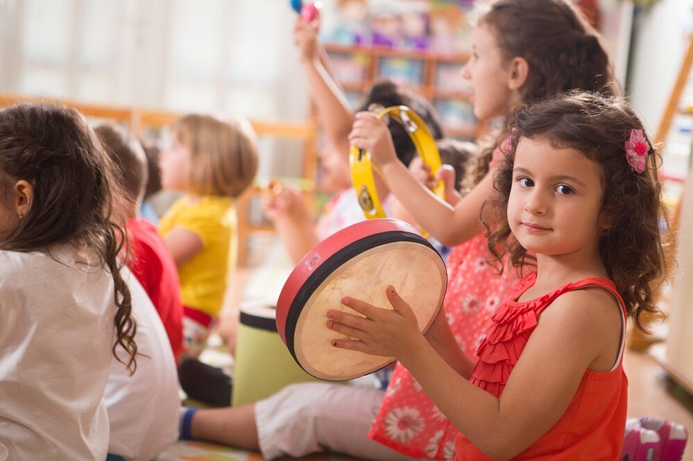 Music Children playing hand held musical instruments