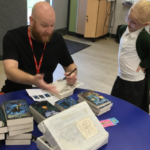Author Luke chats to a pupil