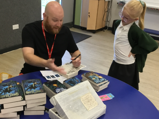 Author Luke chats to a pupil